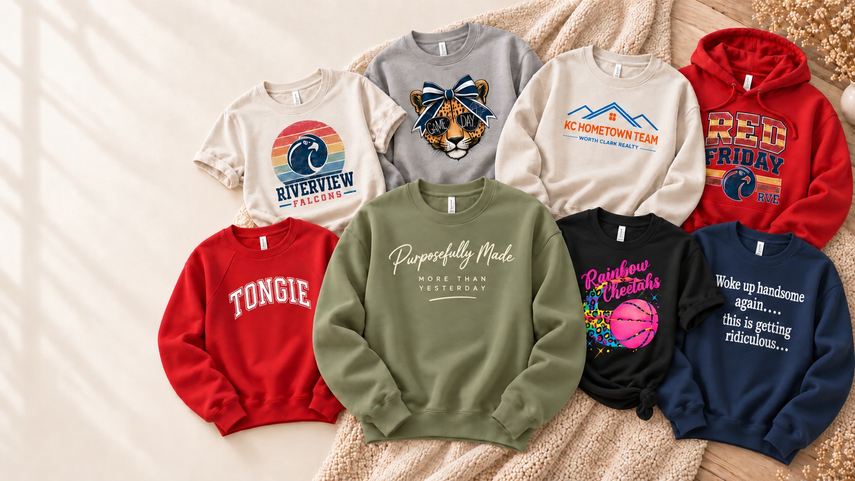 A flat lay of custom sweatshirts and hoodies we've printed, including Riverview Falcons, Rainbow Cheetahs, and Purposefully Made designs